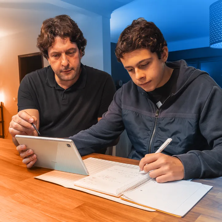 Father and Son looking up information about treatment with TORPENZ™ (everolimus)